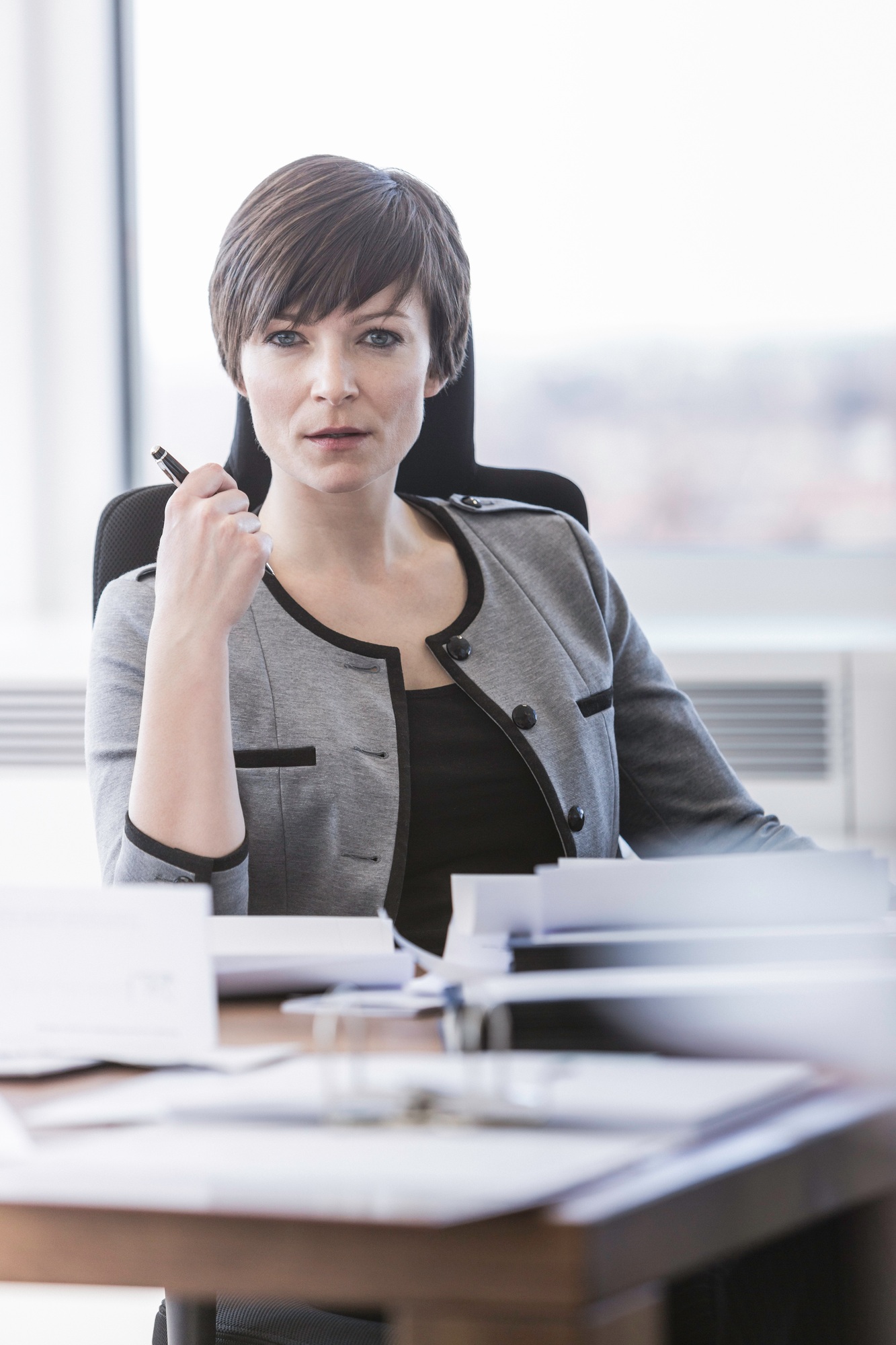Portrait of businesswoman sitting at desk
